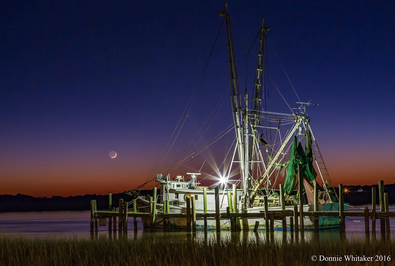 Dusk at Crosby's Seafood by Instagram user (and dunes agent) @donniewhitaker