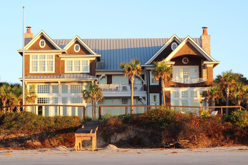 Gorgeous luxury home on beach outside of Charleston, South Carolina, coastal home on the sandy beach, golden hour sunrise, marsh in South Carolina, USA